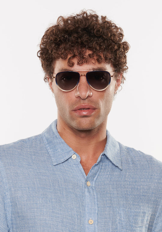 Krewe Coleman Sunglasses In 18K + Matte Indigo Fade + Gravity